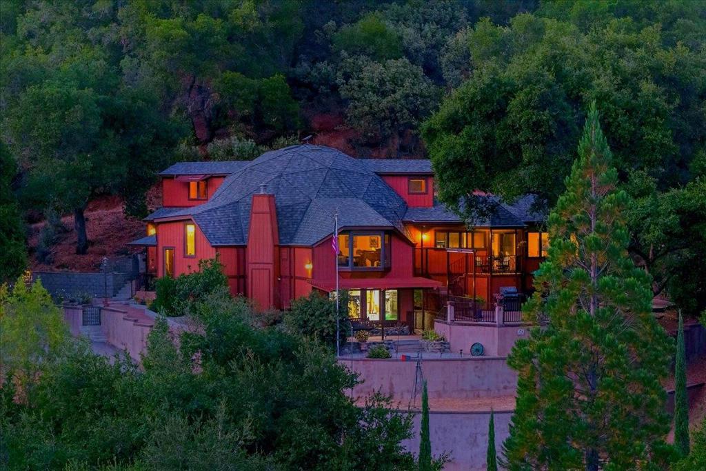 Welcome to 5224 Twin Falls Rd, a private hilltop sanctuary in the coveted Hills of Morgan Hill. This custom built Rivendale masterpiece offers 3,095 sq. ft. of living space, perched atop 4.87 acres with stunning 180 degrees canyon views. The gated driveway crosses a scenic bridge and winds through natures beauty before arriving at this serene retreat. Built for comfort and sustainability, the home features solar power, high-speed internet, and a detached garage, plus additional outbuildings ideal for hobbies or storage. Perfectly positioned along the tranquil Twin Falls at Llagas Creek, it blends modern convenience with the peace of off-grid living. Inside, expansive windows frame the canyon from nearly every room, while hardwood floors, high ceilings, and an open floor plan enhance the light and space. The gourmet kitchen boasts a gas range, stainless steel appliances, and generous counter space. A wood-burning fireplace adds warmth and charm, perfect for cool evenings. Expansive patios invite you to enjoy coffee or wine as the sun sets over the hills. A rare blend of privacy, views, and craftsmanship, all within reach of Morgan Hills or San Jose's amenities and the support of a local volunteer fire department. This is more than a home; it's a lifestyle.