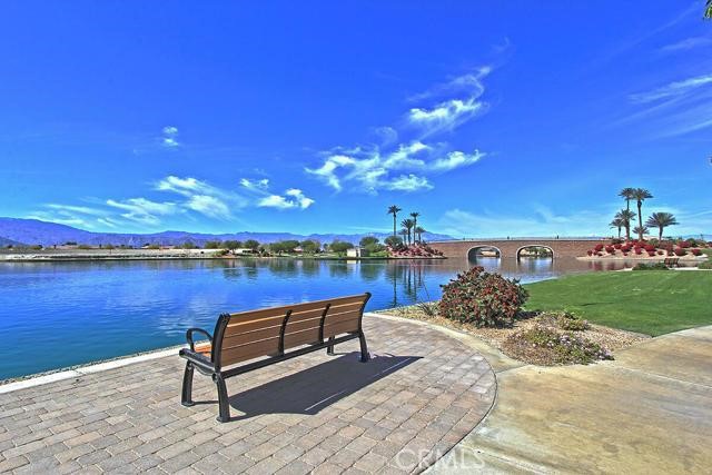 Welcome to Terra Lago a Lake Front Community located one of Indio's most desirable gated communities. This spacious two story home offers the perfect blend of comfort, style, and serene lakefront living. Boasting 4 bedrooms, 3 full bathrooms, 2,431 sq ft floor plan, with plenty of space for both relaxation, entertaining, including a large backyard for beautiful desert evenings. Enjoy the downstairs bedroom with beautiful lake views, conveniently located next to a full bathroom featuring a walk-in shower - perfect for guests or multigenerational living as well as a bonus room providing a versatile space that can easily be used as a home office, playroom or hobby space. Walk into an open-concept great room, where the kitchen, dining area, and family room seamlessly connect, perfect for family gatherings. You'll love the custom cabinetry and the stylish wall-mounted fireplace for cozy evenings, creating a warm and inviting atmosphere. Upstairs you will find a large master bedroom, sunk-in tub, separate shower, and large walk-in closet, along side two good size bedrooms with lake front views. Walk across the street and enjoy the benefits of Lake living, launch your kayak, or enjoy the shared amenities in the beautiful club house, including a fitness center, a refreshing community pool, spa and various play rooms. The rent includes direct tv, trash, security system, a gardener, refrigerator, and washer/dryer. Located just minutes from the 10Fwy, close to several restaurants, department stores, and everything you need is within 5 minutes' drive. Don't miss the opportunity to live in one of Indio's most desirable lake front communities!