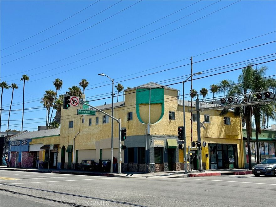 Commanding the prominent corner of S Vermont Ave. and W Gardena Blvd., this mixed-use property offers both visibility and income diversity in one of the busiest intersections in the Los Angeles Harbor Gateway. Classified as Stores Combined with Office, the building includes both residential and commercial uses, making it especially versatile. The upper level is comprised of four multifamily units with long-term residents, providing steady residential income in a high-demand rental market. On the first floor, established tenants include a beauty salon on W Gardena Blvd. and a juice shop plus Aloha Bar on S Vermont Ave., creating varied revenue streams from neighborhood-serving businesses. This combination of apartments and retail gives the property balance and resilience across multiple income categories. The street-to-alley corner lot with dual frontage maximizes exposure and provides strong future flexibility for redevelopment. S Vermont Ave. serves as a major north-south commuter corridor from Downtown Los Angeles into the South Bay, while W Gardena Blvd. provides an essential east-west connection, ensuring visibility from both regional and local traffic. The property’s corner presence makes it especially valuable, distinguishing it from mid-block parcels and offering unmatched signage and identity in the corridor. Its location near the 110 and 405 freeways, LAX Airport, Downtown Los Angeles, and the South Bay Beach Cities further enhances long-term investment value. Surrounded by dense neighborhoods and a thriving mix of local services, the property is positioned to benefit from both strong day-to-day demand and continued growth in the corridor. Investors will recognize the appeal of a mixed-use property with diverse tenants and strong corner visibility, whether held for income, repositioned for stronger rents, or incorporated into a larger redevelopment vision. This offering at 16414–16422 S Vermont Ave. (MLS #SB25196498, APN: 6120-024-018) is located just one parcel from 845 W Gardena Blvd. (MLS #SB25196493, APN: 6120-024-016) and 847 W Gardena Blvd. (MLS #SB25196497, APN: 6120-024-017). Together, the three properties create a rare assemblage spanning nearly a block of commercial and mixed-use frontage in the City of Los Angeles. The simultaneous availability of adjoining and nearby parcels of this scale is exceptionally uncommon, presenting a legacy investment opportunity in one of the most connected corridors between Los Angeles and the South Bay.