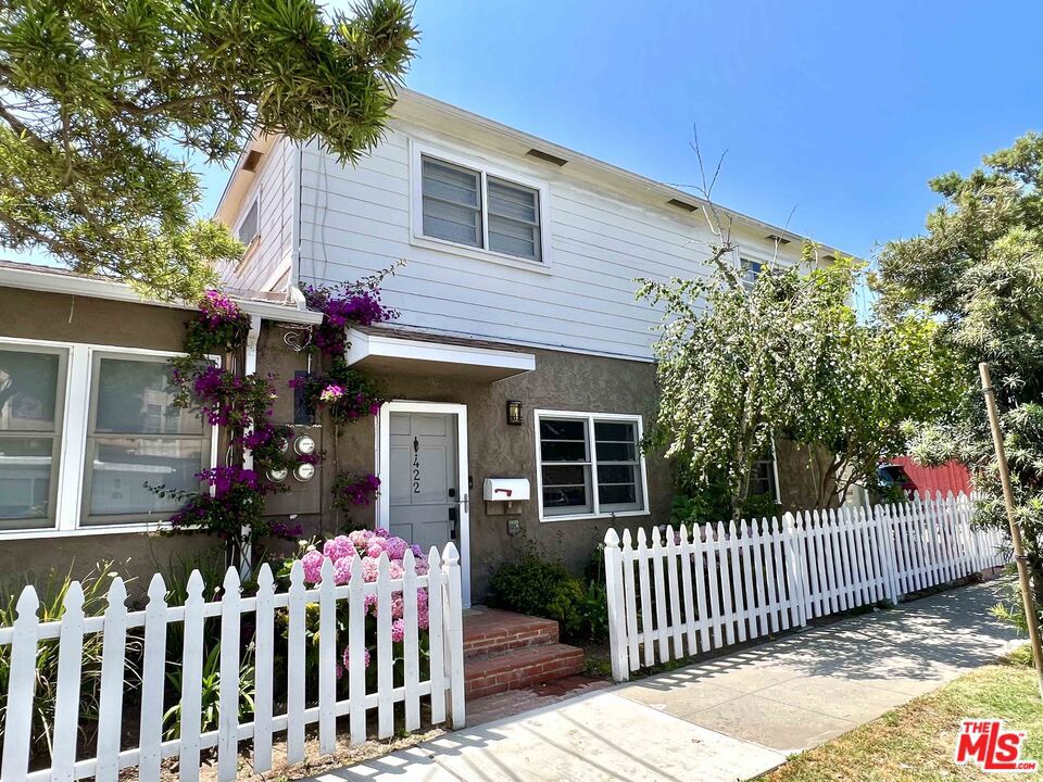 Coastal Living in Prime Santa Monica! Discover this charming, fully remodeled two-story townhome in Ocean Park, one of Santa Monica's most sought-after neighborhoods. Nestled in an intimate four-unit community, this home feels like a private residence with its own street entrance and classic white picket fence. Step inside to an open, sun-filled floor plan with hardwood floors, recessed lighting, and a spacious kitchen with shaker style cabinets, granite counter tops, stainless steel appliances and a cozy eat-in area. Enjoy the convenience of in-unit full-size washer and dryer, your own private patio, and two-car parking. Location is everything, just 4 blocks to the beach and 2 blocks to Main Street's dining, shoping, and nightlife. Minutes to the iconic Santa Monica Pier, Third Street Promenade, Venice Beach, and Marina Del Rey with easy freeway access. This townhome offers the perfect blend of beachside charm, modern comfort, and city convenience.