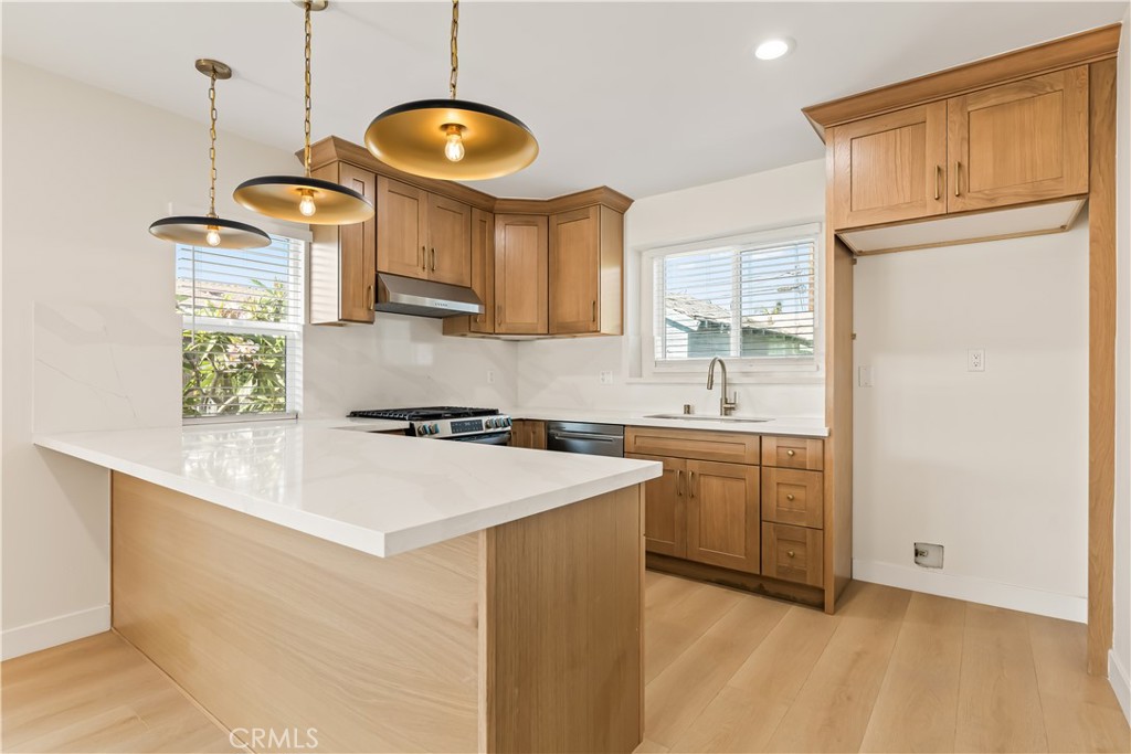 This beautifully renovated single-family home in desirable Arbor Park has been redone from top to bottom with no detail overlooked. It features brand-new electrical, plumbing, insulation, drywall, kitchen, roof and bathrooms. The modern kitchen features oak shaker cabinets, elegant Calcatta quartz countertops, new stainless steel appliances and a spacious peninsula perfect for barstool seating. The spacious living room includes a tastefully updated real wood-burning fireplace and flows seamlessly into the open dining area, which opens to an inviting outdoor patio space beside a blooming plumeria tree. The home offers three bedrooms, including a primary suite with a private deck and custom built-in closets. The en-suite bathroom is a lovely space, with marble floors, a luxurious shower, and a sleek frameless glass medicine cabinet. Step outside to a lush, private yard newly landscaped and filled with vibrant flowers, mature pomegranate trees—a serene space perfect for relaxation or entertaining. Located right off the 405 freeway, and steps from LAX, Westchester, Playa Vista and Culver City, you will not be far from excellent dining, entertainment, beaches, and more! Contact us today!