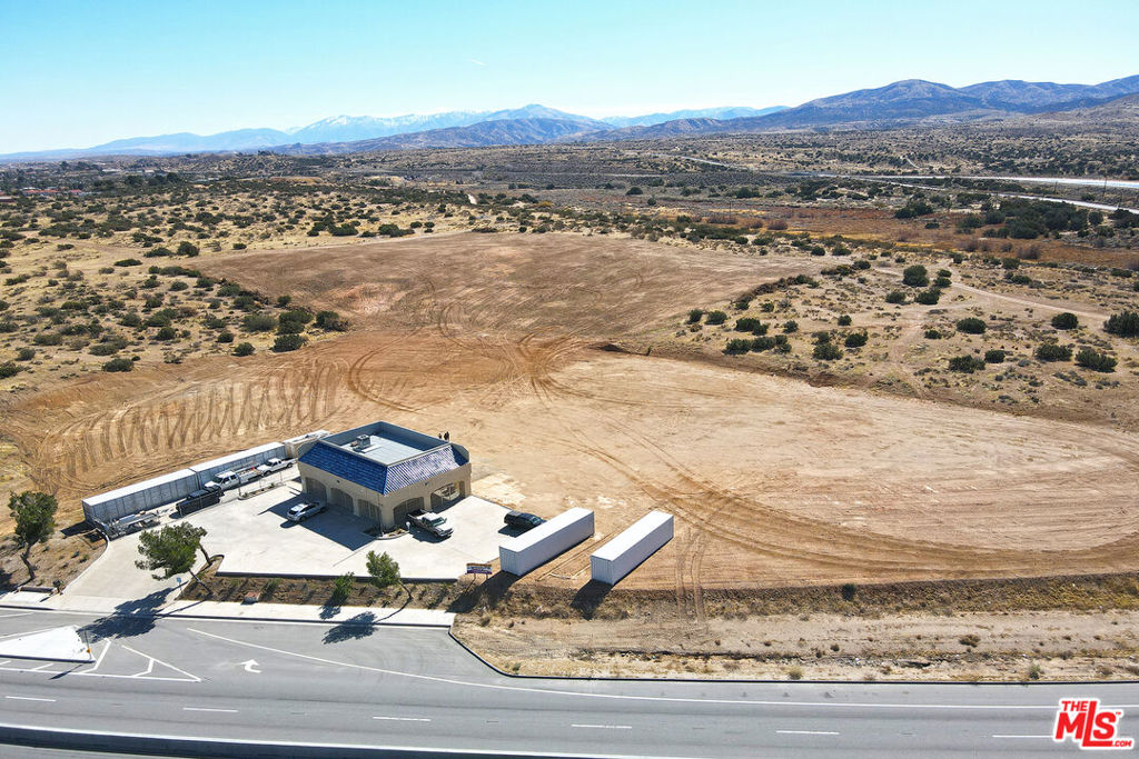 Looking for an exceptional property with new development in Progress in Palmdale, CA? Look no further than this 1,200 SF recently rennovated office building and 9.34 acre parcel of flat land! with over 800 of Pearblossom Highway frontage. This property offers excellent exposure for your business or future development project. Located at 2660 Pearblossom Highway, just east of 25th Street East in Palmdale, this property offers quick and easy access to downtown Palmdale, the airport, Highway 14 and Highway 138. The office building has direct access from the newly reconstructed Pearblossom Highway. The property consists of three separate parcels of land. The office building is located on APN 3053-009-017, which is approximately 2.43 acres in size and has recently been graded for development. The adjacent parcel, APN 3052-015-055, is approximately 1.76 acres and has high daily traffic volumes for excellent marketing exposure. To the south is APN 3052-015-058, a 5.15-acre residential parcel. Parcels 017 and 055 are zoned C1 (Light Commercial), which allows for a wide range of non-residential uses, including office, retail. Parcel 058 is zoned R-1-1. Buyers should verify zoning and that it will allow their intended use. The office building has water (including fire hydrant). Current owners have plans underway to develop a boat & RV storage and a self-storage facility.