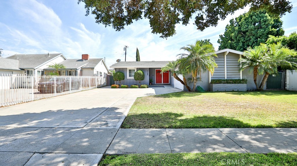 Beautifully maintained since 1989, this Mid-Century Modern home is truly a gem. The original hardwood floors have just been refinished in a natural tone, highlighting its timeless charm. Fresh designer interior paint and smooth ceilings create a bright, updated feel throughout.
The inviting living room features a brick fireplace and French doors that open to the backyard, blending indoor comfort with outdoor living. The remodeled galley kitchen boasts a brand-new stainless steel dishwasher, freestanding stove, and even a sleek electronic faucet. A cheerful breakfast nook offers plenty of natural light and direct access to the backyard.
Both bathrooms have been tastefully remodeled: the hall bath includes a tub with a new glass enclosure, while the ¾ bath—conveniently located between the laundry room and an additional bedroom—also features a glass-enclosed shower. The split floor plan provides privacy with two bedrooms and a hall bath on one side, and a third bedroom with its own ¾ bath on the other.
This home also offers modern upgrades including newer dual-pane windows, a newer roof, tankless water heater, central air, upgraded insulation, and fresh paint. The spacious private backyard includes two orange trees, mature landscaping, and greens.
Washer, dryer, and refrigerator will be gifted by the seller, making this home move-in ready and waiting for you.
