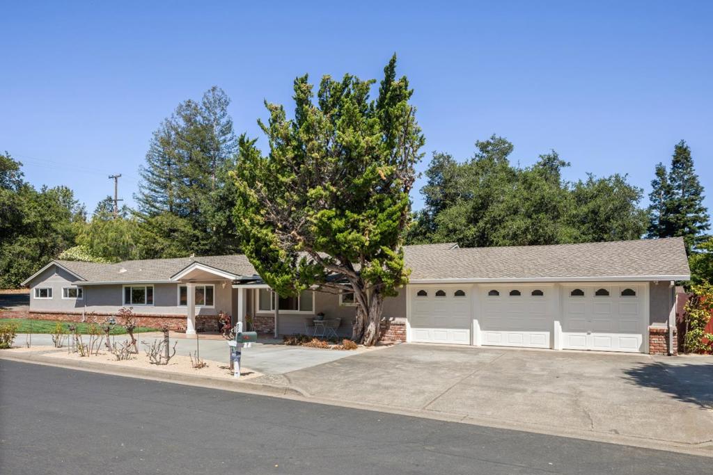 880 Moana Ct is the perfect launchpad for life in the Valley. Positioned at the nexus of innovation and convenience, this exceptional 3-bedroom, 2.1-bath residence offers the ideal blend of style, space & functionality. Located just minutes from Stanford-Google-Meta-Apple & the region's top venture firms. For those who demand space and function, the property offers two attached garages, a traditional 2-car garage plus a rare 5-car garage, providing endless possibilities for car enthusiasts-hobbyists-or anyone in need of storage or workshop space. The airy living room provides additional areas perfect for a reading nook, or play zone. Extensive crown molding, recessed lighting, and louvered shutters, create a refined and timeless ambience. Enjoy memorable meals with your guests in the formal dining room. Don't miss the additional room next to the 2-car garage, which is perfectly suited for a quiet remote work hub, content studio, or maker space. Live just moments from top-rated schools-world-class tech campuses-miles of biking and running trails-parks & vibrant downtown areas offering dining-shopping & culture. An extraordinary offering for those seeking understated elegance, rare functionality, and unparalleled convenience in one of California's most coveted addresses.