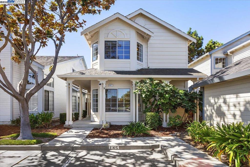 Step inside and fall in love with this outstanding North-East facing home, graciously filled with natural light throughout the day. Designed for effortless living, it blends modern comfort with timeless style and comes with the peace of mind of a brand-new roof. The kitchen with granite counter opens to a bright breakfast nook, while the spacious great room with vaulted ceilings creates a welcoming space to relax by the wood-burning fireplace. An adjacent formal dining area is ideal for hosting family and friends. A versatile downstairs bedroom and half bath provide the perfect setup for guests, a home office, or a creative studio. Upstairs, the serene primary suite and a second bedroom both feature vaulted ceilings, offering airy retreats filled with natural light. The primary suite also includes a walk-in closet and spa-like bath with dual vanities. An additional guest suite and convenient laundry closet complete the upper level for everyday ease. This home also comes with access to a heated pool, greenbelts, and a playground. Starbucks, Costco, Pacific Commons, theaters, and more are just minutes away, with quick access to I-880, the Dumbarton Bridge, and tech shuttles for major firms - making this the perfect blend of comfort, convenience, and location.