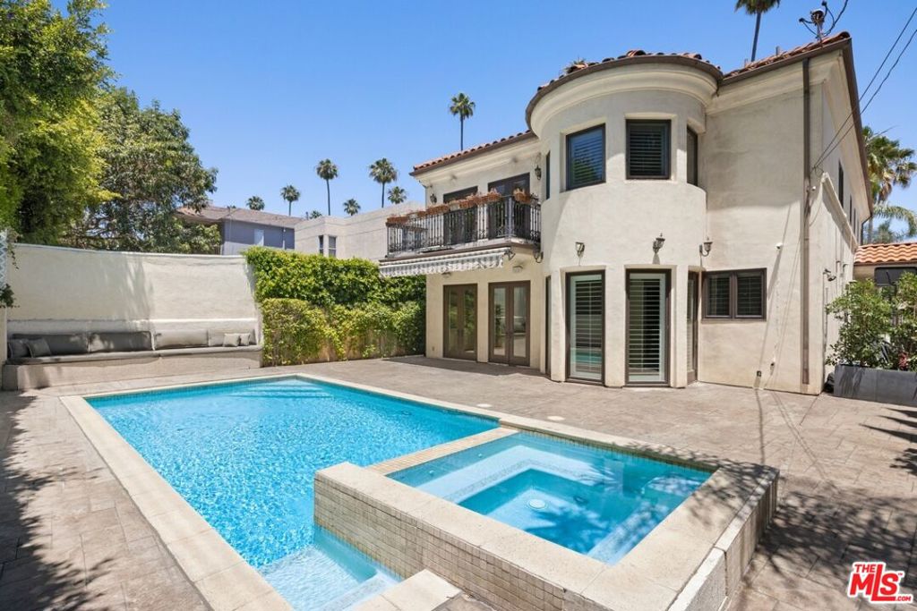 LOCATION, LOCATION, LOCATION!!! ULTRA PRIVATE 5 BEDROOM compound located in the heart of BEVERLY HILLS and minutes to cedars Sinai, The Grove, Hollywood, etc. This elegant home seamlessly blends classic charm with modern luxury, offering a spacious and inviting living environment. Upon entering, you are greeted by a grand foyer with high ceilings and stunning hardwood floors that lead you through the meticulously designed floor plan. The main level features a formal living room, a formal dining room perfect for entertaining, AND an oversized bright and airy family room that opens up to a beautifully landscaped backyard with a HEATED POOL. Enjoy the gourmet kitchen which is equipped with top-of-the-line stainless steel appliances, custom cabinetry, and a large center island. Additional amenities include a home office, a media room, and a two-car garage. Located in one of Beverly Hills' most coveted neighborhoods, this home provides easy access to world-class shopping, dining, and entertainment options, while offering the privacy and tranquility of a luxurious retreat. Experience the epitome of California living in this stunning Beverly Hills residence.