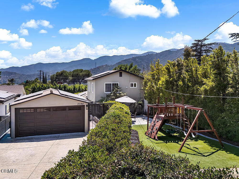 Welcome to this delightful remodeled home in the heart of La Crescenta, offering a perfect blend of comfort and convenience. Ideally situated within close proximity to local schools and shopping centers, this property provides easy access to all your daily necessities. The main house features an inviting living space with engineered wood floors, freshly painted kitchen cabinetry and sliding door to the open yard, perfect for relaxation and entertaining. The main level offers a dedicated layout with common living rooms, laundry hook ups, one bedroom and two bathrooms. The upper level features a large bedroom suite with a full bathroom. The home is complemented by a spacious, private turf grassy front yard with play structure, complete with a newly refinished pool and entertaining patio -- ideal for family gatherings or quiet outdoor enjoyment. An added bonus is the Accessory Dwelling Unit) providing flexible living options - whether it's for extended family, guests, or potential rental income. The property is surrounded by a tall privacy hedge, creating a peaceful and secluded atmosphere, making it feel like a personal oasis. Additional amenities include solar panels for both the home and ADU, tankless water heater, newer HVAC, and large driveway suited for ample parking. Don't miss this impressive opportunity!
