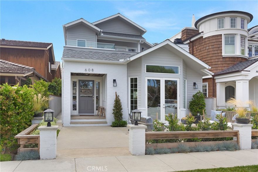Completely redesigned and reconstructed 3-bedroom single family home with a 2-bedroom guest apartment, for a total of 5 Bedrooms and 3 Bathrooms. Infused with natural light and the finest fixtures and finishes throughout, the home is brimming with walls of windows, wide-plank wood flooring and soaring ceilings. Instrumental to the Village lifestyle, the large front courtyard is off French doors from an expansive living room replete with fireplace. A main floor ensuite bedroom and formal dining room lie adjacently to the performance kitchen providing abundant cabinetry, sprawling quartz counters, a walk-in pantry, center island, breakfast nook and bay window overlooking the rear entertaining patio that separates the main house from the back house. The expertly designed master bedroom supplies a retreat with fireplace, walk-in closet, sundeck and spa-like master bath with marble vanity, separate spa and glass-framed shower. The rear house has a full kitchen with breakfast bar, private entrance, personal laundry indoor units, and large living spaces. Live the Corona del Mar Lifestyle in the highly sought-after section of the Village; near Begonia Park and centrally located to beaches, shops and restaurants.