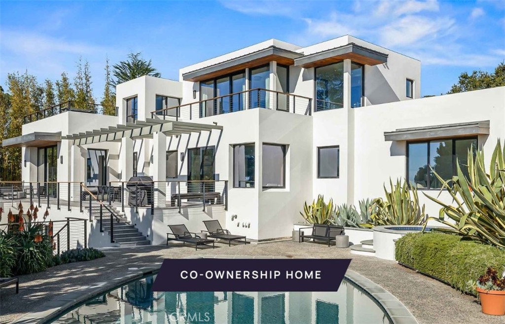 New co-ownership opportunity: Own one-eighth of this professionally managed, turnkey home by Pacaso. This contemporary showcase offers superb vistas, spacious rooms, and seamless flow to terraces and gardens. With ocean views below and mountains above, this 4-bedroom, 5-bathroom retreat is unparalleled. The open-concept great room features a sleek kitchen, dining area, and lounge, opening to a Pacific-view terrace near the pool or a walled garden. A striking wood, steel, and glass staircase connects the levels. The main-level primary suite offers a zen-like en suite and pool terrace access. A rooftop wet bar complements the secondary suite. Additional features include a fourth bedroom with a garden terrace and luxurious furnishings throughout.
