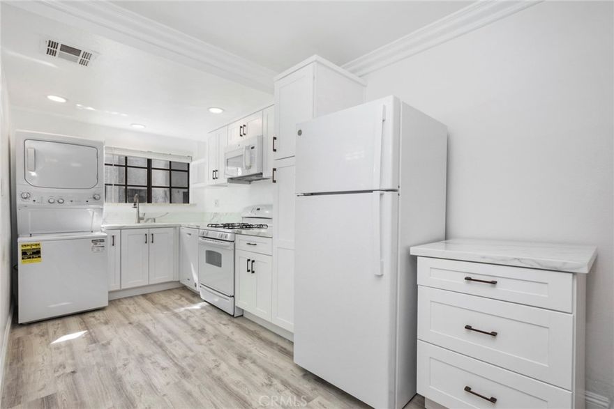 Experience urban living at its finest in this fully remodeled, contemporary townhouse located in the heart of Downtown Los Angeles. Thoughtfully redesigned, this two-bedroom, two-bath residence offers modern style, functional comfort, and effortless convenience.

Step inside to a bright, open living space enhanced by sleek finishes and abundant natural light. The chef-inspired kitchen features brand-new appliances, quartz countertops, and generous cabinetry, creating an ideal setting for cooking and entertaining. The home also includes in-unit washer/dryer hookups for added ease.

Both bedrooms offer excellent privacy and comfort, while the updated bathrooms showcase modern fixtures and clean, refined design.

Set in a prime Downtown location, you’re just moments from LA’s top restaurants, boutique shopping, cultural landmarks, and vibrant nightlife. Whether for work or leisure, everything you need is within minutes.

A rare opportunity to enjoy turnkey living with unmatched accessibility. Schedule your private showing and make this modern urban retreat your new home.