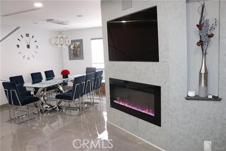 In the heart of Cabrini Villas sits this 3 bedroom/2.5 bathroom glossy modern home and honestly, what doesn't it offer? From extra storage convenience to top of the line modern technological features such as Nest Ac with vents in the ceilings, with central AC running all the way down to the garage gym/office, to surround system speakers and recessed lights built right into the living room ceiling, a flat screen TV and gorgeous fireplace build into the wall staring across a modern build spacious living room with grey marble flooring that spans all the way to the dinning room and new-top-of-the-line kitchen cabinets and equipment. The listing will include the matching set refrigerator, built in Tv, washer/dryer unit in garage, and much more. As you enter the house into a beautiful foyer, you will see a newly built staircase right in front, each step with built in lights underneath and a solar powered skylight up above which casts natural light during the day and electrical lighting during night time. The upstairs holds a master-bedroom which comes with a walk in closet/office space and master bathroom. With 2 other spacious bedrooms with their own closets and a shared bathroom. The first floor garage level also holds an extra spacious room which can be used as an office or game room for the kids! The garage has also been fully remodeled with lots of cabinets and storage space and has a very clean/tidy feel to it. The washer/dryer and electric water heater are in the garage storage hidden. Garage door can be opened via iphone and house comes with security cameras for extra safety. HOA fees cover cold water, interenet, and cable! The home also comes with a private patio on the main floor which holds space for a full seating set, a grill, and a *heavy duty counter top (*which will be included in the lease as well). Cabrini villas itself offers a multitude of pools, tennis courts, parks, and a safe environment to live in.