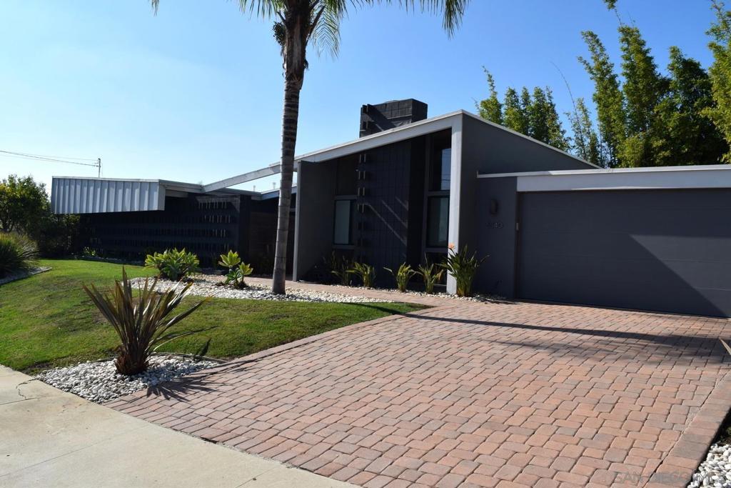 Beautiful single-level mid-century modern home. This 4-bedroom, 2-bath residence features an airy open floorplan accented by rich hardwood floors and a living room fireplace that serves as a warm centerpiece. The spacious kitchen flows seamlessly into the living and dining areas, making it ideal for entertaining or relaxing with family. Enjoy year-round comfort with air conditioning and efficient forced-air heating. A dedicated laundry room adds everyday convenience. Large sliding glass doors invite you outdoors to a large backyard. The home combines iconic mid-century charm with modern updates, all on a single level. Tenant pays water, gas, electricity and internet. No pets, no smoking. 1 year lease. $35 per applicant credit check fee.