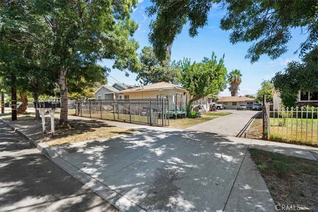 Great Investment Opportunity! This gated fourplex features four 1 bedroom, 1 bath units, each offering a kitchen with plenty of cabinet space, a dining area that opens to the living room, and one assigned parking space. Perfect for investors or buyers looking to live in one unit while renting out the other three. Conveniently located near shopping centers, schools and freeway access. Please note that the property has one parcel but four different addresses the other three addresses are 1321, 1323, 1325 North Sierra Way, San Bernardino