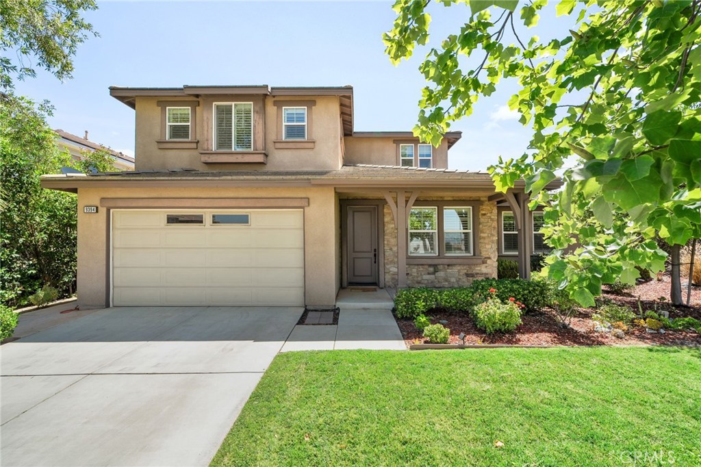 Step into this beautifully maintained Woodcrest home, where lush curb appeal and a charming front porch instantly invite you in. Just beyond the entry, you’ll find a versatile space perfect as a playroom, office, or den—complete with doors for added privacy. A formal living or dining room adds to the home’s flexibility, while the open rail staircase and plantation shutters throughout create a bright, elegant ambiance.
The spacious family room is ideal for relaxing or entertaining, featuring a cozy fireplace, media niche, and seamless flow into the kitchen. The kitchen is a chef’s delight with granite counters, a generous island, built-in oven and microwave, a built-in desk area, and a convenient butler’s pantry. Sliding doors lead to the serene backyard, offering indoor-outdoor living at its finest.
Downstairs features a primary suite is a peaceful retreat with a ceiling fan, sliding doors to the backyard, and an en-suite bathroom featuring a walk-in shower.
Upstairs, you’ll find a second expansive primary suite with dual walk-in closets, a ceiling fan, and a spa-like bathroom with a soaking tub and separate shower. Two additional upstairs bedrooms—each with ceiling fans and shutters—share a dual-sink bathroom. A built-in hallway office nook and a well-appointed laundry room with cabinets, a sink, and a hanging rack complete the upper level.
The backyard is a tranquil oasis, showcasing a solid patio cover, a small retaining wall, and beautifully manicured landscaping—perfect for outdoor gatherings or quiet evenings at home.
This thoughtfully designed home offers space, style, and functionality in every corner.