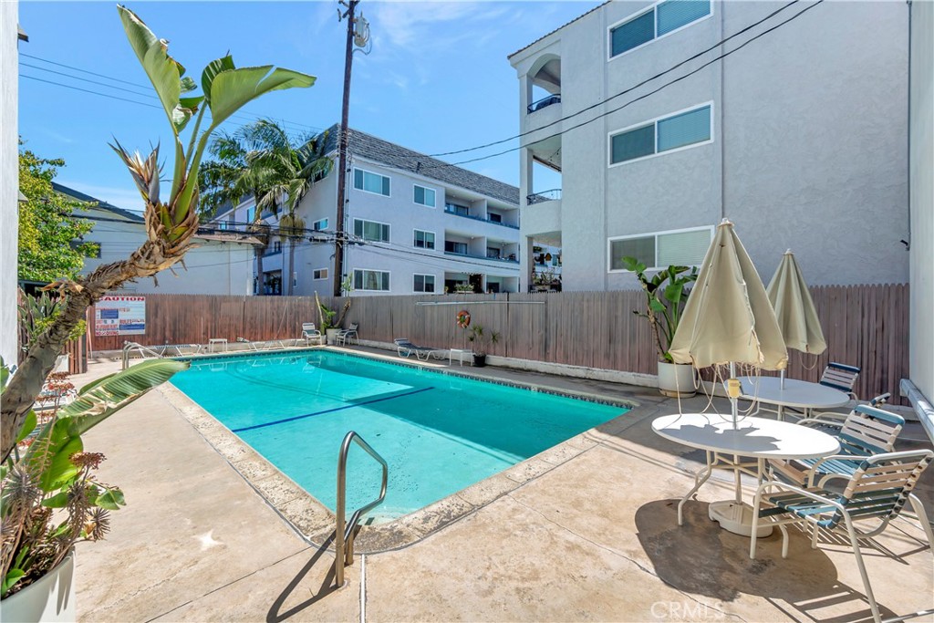 This updated and stylish condo is located in a fabulous mid-century building in the heart of Long Beach. The open concept living room with recessed lighting and beautiful wood floors flows perfectly into the dining room and kitchen. From the granite counter tops and stainless-steel appliances to the ample counter space, the kitchen provides all of the best amenities for meal prep and entertaining. Sliding glass door opens out to a private balcony. The light and bright bathroom features a tub, toilet and has extra storage. The large bedroom has plenty of room and has a large closet and a ceiling fan. This complex provides many different seating and entertaining spaces throughout the grounds. Just a short walk through the beautiful tree lined atrium and you are at the private swimming pool, BBQ and dining space for entertaining, and even a community gardening area. Additional features include a community laundry room, and one assigned parking spot in the secured subterranean parking which includes storage. Bring your pets! Enjoy walking to limitless locations like cafes, restaurants, 4th Street Corridor, retro row, shopping, and the beach just a mile away!