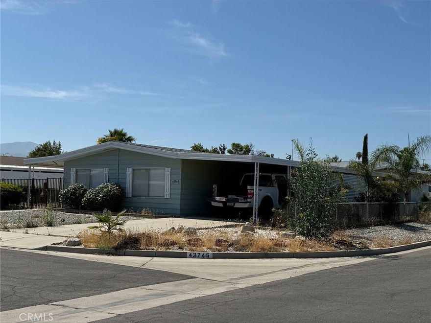 This is a very nice home in a quiet 55+ neighborhood. This home is move ion ready. 2 big bedrooms and 2 full bathrooms. Newer flooring, Granite counter tops and plenty of cabinets, there is a small island with the stove top and hood and more storage. this home site a corner lot so no neighbors on 2 sides. There is an RV gate and this property has enough room to build either a garage or a big RV covering.
