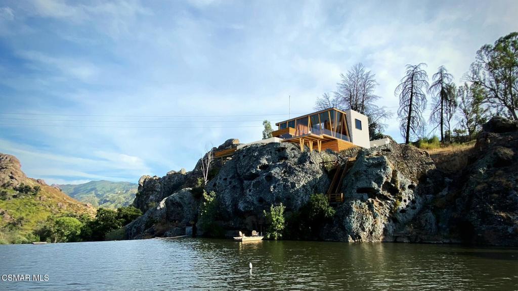 Majestic Views & practically Ready to Build. Welcome to the most scenic lot on Malibou Lake. Unobstructed panoramic views of lake, dam, and Malibu Creek State Park. Private and secure gated community--And your own personal boat dock. Minutes away from Malibu and PCH beaches. Quick few miles to restaurants, amenities, and freeway access. Malibou Lake Mountain Club membership includes boating, tennis, swimming pool, and community events. Option to purchase adjacent lot together at 28805 S Lakeshore. Current and valid DRP (Department of Regional Planning) and Fire Department Water & Access approvals, valid for the Woolsey Fire rebuild plans shown on the renderings(Some renderings may be from alternate permitting routes). Regional Planning stamped approval for 2657sqft home, 643sqft garage, and 1478sqft deck. Buyer will continue the Building & Safety process to obtain the final construction permit from LA County Unincorporated by receiving final approval from the County agencies. Potential 18-month permit extension could be granted thanks to recently passed AB2729, to be confirmed.