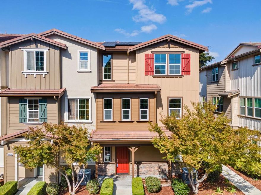 Nestled in the heart of the desirable Emerald Vista community, this stunning tri-level townhome has been recently updated and offers the perfect blend of modern amenities, thoughtful design, high ceilings, and commuter-friendly location. An ideal end unit with triple exposure and unobstructed views, this home invites in abundant natural light and presents exceptional value. Home features a fully paid off Solar Panel system as well!