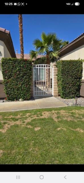 Welcome to this beautifully maintained home located in the desirable community of Esplanade. This spacious residence offers 3 bedrooms plus a den and 2 baths with an open floor plan designed for both comfort and style. The living area features high ceilings, natural light, and a fireplace. The kitchen is equipped with stainless steel appliances, granite tile countertops, and ample cabinetry. Primary suite offers a relaxing retreat with an en-suite bathroom, walk-in closet, soaking tub, etc..Step outside to enjoy a private backyard perfect for entertaining. Additional highlights include a 2-car garage and a private laundry room with a sink and cabinets for additional storage. Conveniently located near shopping, dining, golf, and schools, this home is ideal for those looking to experience the La Quinta lifestyle. The detached casita is not inclded.