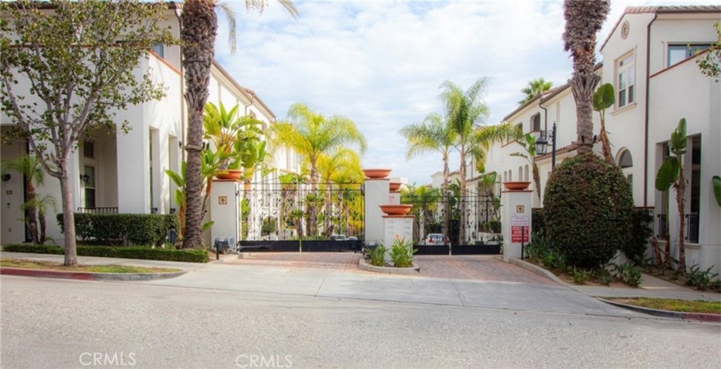 Seller is Highly Motivated to Sell or Rent this home! Welcome to The Cienega, a stunning Mediterranean-style gated community built in 2006. Surrounded by lush tropical landscaping, charming Mediterranean tile accents, Spanish-tiled roofs, and picturesque brick driveways, this community offers both beauty and tranquility. This exceptional tri-level townhouse, the largest and rarely available floor plan in The Cienega, was originally the Builder’s Model Home. Offering nearly 2,000 square feet of luxurious living space, this home features 3 bedrooms and 4 bathrooms, with each bedroom having its own private bath and walk-in closet for ultimate privacy and convenience. The top floor is home to the expansive master suite, which includes a spa-like bathroom with dual sinks, an oversized jetted tub, and soaring ceilings. The second bedroom upstairs also enjoys an en-suite bathroom and generous closet space. The mid-level is perfect for entertaining, with an open kitchen featuring granite countertops, stainless steel appliances, a spacious center island, and plenty of storage. The adjoining dining area flows seamlessly into a powder room and a laundry room for added convenience. The lower level offers a private retreat for guests or the perfect home office. Throughout the home, enjoy custom mahogany wood shutters, gorgeous solid bamboo flooring, and recessed lighting. Each level is equipped with its own thermostat, and the home’s superb insulation ensures energy efficiency year-round. The garage is equally impressive, featuring epoxied floors, custom cabinetry, recessed lighting, and an electric vehicle charging station—perfect for your Tesla or electric car! Two private balconies provide breathtaking city views, and on clear nights, you can even catch a glimpse of the Disneyland fireworks from the top floor. The home is pre-wired for FiOS, security system, and surround sound. With its elegant finishes, spacious layout, and location in a highly sought-after community, this home offers the perfect combination of comfort and style. Units in The Cienega don’t come on the market often—this one is not to be missed! CALL YOUR FAVORITE REALTOR TODAY TO SCHEDULE AN APPOINTMENT!!