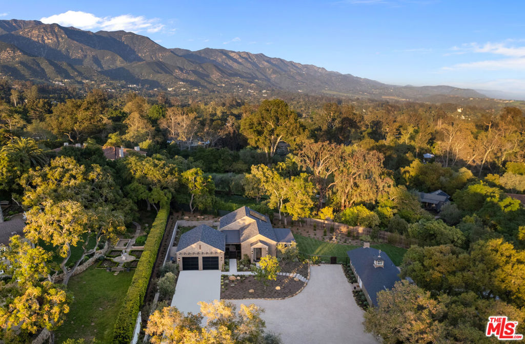 Enchanting ultra-private estate located in the heart of Montecito in the highly sought-after Cold Spring School District. Enter the gated 1+/- acre property, and you will find not only one, but two inviting homes providing a modern compound on the manicured park-like grounds designed for entertaining and serenity. The charming single-level main house with a new roof includes 2 bedrooms + loft and 1 bathroom, a remodeled kitchen with Bosch appliances, vaulted ceilings, and a cozy living area with a fireplace. The home overlooks the sprawling parcel, complete with multiple outdoor seating areas, including a large entertainment patio with a built-in BBQ, outdoor fire pit, planter beds ready for full bloom, putting green, generous motor court, and additional structure perfect for a flex .space for an office, art studio, or exercise room. Elevating the property even further, the grounds are complete with a brand new 2 bedroom, 2 bathroom home (ADU) finalized in 2024 with 10 foot high ceilings, a gourmet kitchen complete with a Wolf stove and Miele appliances, HALO water filtration system, A/C, custom made white oak cabinets, and open-plan living room with an electric fireplace and bifold Euroline steel doors designed for seamless indoor/outdoor living leading out to the covered patio. The home features spacious bedrooms, spa-like bathrooms, and large closets with custom built-ins. No detail was missed with solar panels on the roof and an expansive detached +/- 750 sq. ft. 2.5-car garage with a 60 amp receptacle for a car charger and private laundry area.The ADU was built with a vision for multigenerational living, and while both homes are move-in ready, there is plenty of room to make your own vision come to life by expanding upon the main residence to create your dream home.This property includes many unseen site improvements, including a new underground electrical pole to a 400 amp panel in the trash enclosure providing 200 amp to the ADU and 200 amp at the main house, a new sewer lateral with 2 backflow devices, all new underground sewer, and new underground gas and water lines.Privacy coupled with proximity, the property is close to the Montecito villages, hiking trails, beaches, shopping, fine dining, and all that Montecito has to offer, making it the ideal place to call home.Please see floor plans. Main home is +/- 1254 sq. ft. and ADU is +/- 1199 sq. ft., with a +/- total sq. ft. of 2453 sq. ft. on the two structures. Garage is +/- 750 sq. ft.