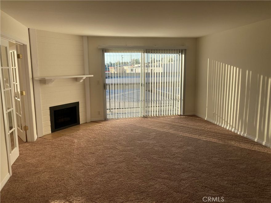 Large 2 bedrm + 1 bath condo in a nice and quiet gated community.  This is a spacious corner unit that was remodeled a few years ago.    Unit has a good sized balcony.  Close to public transportation, stores and freeways. Laundry hook ups inside the unit with a cozy fireplace in the living rm.