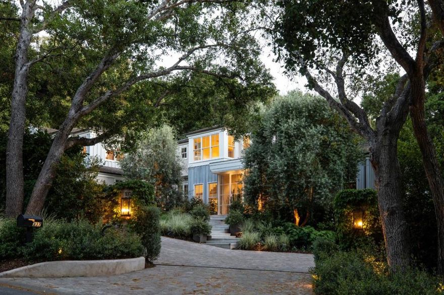 In a private country setting on the westside, this Napa Valley-inspired estate home was built by renowned Pacific Peninsula Group on 1.07 acres. The home marries contemporary architecture with sophisticated style and solar power opening to garden terraces with living walls, fountains, and a soothing fireplace. Every inch is beautifully rendered across three levels, all with amazing natural light and Belgium fumed oak floors throughout. There are 5 bedroom suites, a large office, plus additional 1-bedroom guest quarters.  Living spaces are designed for elegance and comfort, highlighted by a grand living room, a formal dining room, and a gourmet kitchen that leads to an inviting family room. The lower level unfolds with luxury amenities like a home theatre, wine cellar, plus fitness center and spa bath with steam shower and sauna. Access to Las Lomitas schools adds the finishing touch. Location, privacy, and absolute quality  the perfect place to call home.