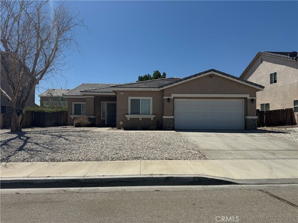 Brand new vinyl plank flooring throughout!! Newer paint. Excellent floor plan - Split floor plan with 4 spacious Bedrooms and 3 Full Baths. Kitchen opens to breakfast area and family room with fireplace. Backyard has a lot of concreate and a large covered patio along with a storage shed. Desert friendly rockscape in front. Close to all major roads, shopping and just minutes away from I-15. This one is a must see!