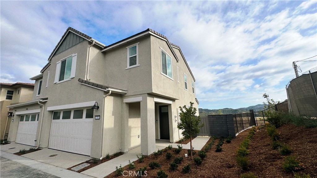 **Stunning Views and Modern Luxury Await!** Welcome to this beautiful luxury home in the exclusive Juniper community at Rienda! Set on a rare, premium corner lot, this 3-bedroom, 2.5-bathroom home boasts breathtaking panoramic views of the park and mountains. Featuring one of the largest floor plans, this home is designed for both comfort and elegance. Step inside to a sunlit, open-concept living space with upgraded wood flooring and a seamless flow between the living area, dining space, and gourmet kitchen. Luxury glass sliding doors lead to the backyard, where you’ll enjoy unobstructed views, perfect for entertaining or relaxing. A convenient powder room on the main floor adds to the ease of daily living. Upstairs, the master suite offers serene views, a dual-sink bathroom, and plenty of closet space, providing a perfect retreat. Two additional bedrooms share a stylishly upgraded bathroom, all move-in ready with thoughtful finishes throughout. Enjoy a lifestyle enriched by the community's school and park, both within walking distance. Take full advantage of the array of amenities, including pools, fitness centers, tennis courts, playgrounds, and scenic trails—everything you need to relax and recharge.