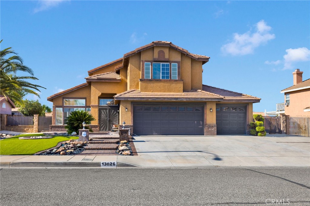 Welcome to 13026 Canta Loma Lane! Discover the perfect blend of comfort and lifestyle in this Victorville gem! Nestled at the end of a quiet cul-de-sac, this inviting two-story home offers both function and charm. The downstairs bedroom with Jack-and-Jill bath is ideal for guests, in-laws, or creating a private retreat of your own. The high ceeilings offer a large than living space to the living room and formal dinning space. Walk through into a large and spacious kitchen, with plenty of cabinetry for storage. A breakfast nooks with windows offers a perfect cozy place to start the day with family looking out to your beautiful back yard. A large family room, with fireplace, provides space for entertaining or for winding down after a long day. Head upstairs to find a spacious layout that provides room for everyone—from the primary bedroom with it's own balcony to your primary ensuite, with spacious soaking tub and large closet. Additionally you will find 3 very spacious bedrooms, with full hallway bathroom.
Step outside and imagine summer days by the sparkling pool, BBQs with loved ones, and evenings unwinding in your own spa under the desert sky. With schools, shopping, dining, and freeway access just minutes away, this home is more than just a house, it's a place to create lasting memories with everyday living both easy and enjoyable. Don't miss out!