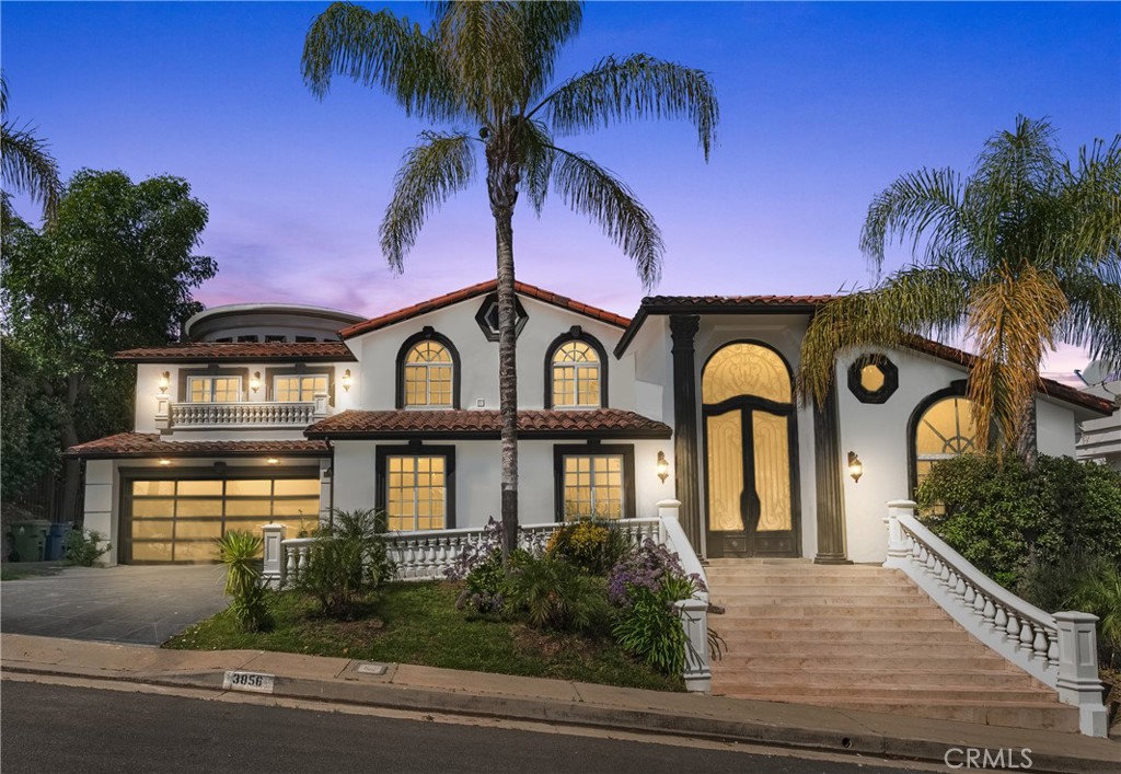 Luxury Living in the Heart of Encino – South of the Boulevard. Welcome to this fully remodeled Mediterranean masterpiece, where luxury meets everyday convenience in one of Encino’s most prestigious neighborhoods. Set south of the Boulevard with unobstructed panoramic views seen from the living spaces and bedrooms, this stunning estate offers over 4,600 square feet of sophisticated living space on an expansive 18,000+ square foot lot. Step through dramatic 20-foot iron doors into a grand entrance highlighted by an 8-foot-wide chandelier, setting an unforgettable first impression. The open-concept layout is designed for modern living and effortless entertaining, featuring abundant natural light and a formal dining area perfect for hosting. The gourmet kitchen is a chef’s dream, outfitted with top-of-the-line appliances, custom cabinetry, and premium finishes. This home offers dual primary suites, each providing its own luxurious retreat—one featuring a soaring dome ceiling and spa-like bathroom, and the other showcasing a sleek, modern soaking tub for ultimate relaxation. An illuminated onyx stone bar with LED lighting anchors the entertainment space, while the backyard transforms into a private oasis with lush new lawns, a sparkling pool and spa, a wet bar, and a built-in barbecue — ideal for unforgettable gatherings under the California sun. Additional highlights include 5 generously sized bedrooms, 6 elegant bathrooms, energy-efficient solar panels, and access to a private community tennis club. Located just minutes from fine dining, premier shopping, and prestigious schools, this estate offers the perfect blend of serenity, style, and prime convenience.