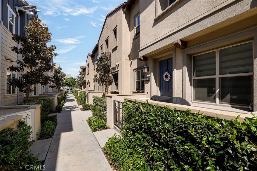 Welcome to this newer construction 3-bedroom, 2.5-bathroom condo nestled in the highly desirable Groves master-planned community in Whittier. This home boasts a large private patio and an ideal location within the community--just steps away from the community pool and common area. Step inside to an open and airy floor plan designed for modern living and effortless entertaining. The stylish kitchen features sleek quartz countertops, stainless steel appliances, and overlooks the spacious living and dining areas. A convenient powder room is located on the first floor, along with direct access to an attached 2-car garage. Durable laminate flooring flows seamlessly throughout the home. This property also includes fully paid solar panels, offering energy efficiency and long-term savings. Upstairs, you’ll find all three generously sized bedrooms and a laundry room. The spacious primary suite includes a private ensuite bath and a walk-in closet for added comfort and convenience. The Groves community offers resort-style amenities, including an 11,000-square-foot clubhouse, two sparkling pools, a fitness center, spa, BBQ stations, and more. Enjoy year-round activities such as food trucks, Movies Under the Stars, and festive holiday celebrations—creating a true sense of community. Conveniently located near shops, dining, Whittier College, and the 605 freeway, this townhouse is a true gem. Everyday essentials are just steps away with an adjacent shopping center featuring In-N-Out, Raising Cane’s, Chipotle, Philz Coffee, Stater Bros, and EOS Fitness. Plus, the exciting new Rodeo72 food court! Don’t miss out—schedule your showing today and experience the perfect blend of comfort, convenience, and community living!