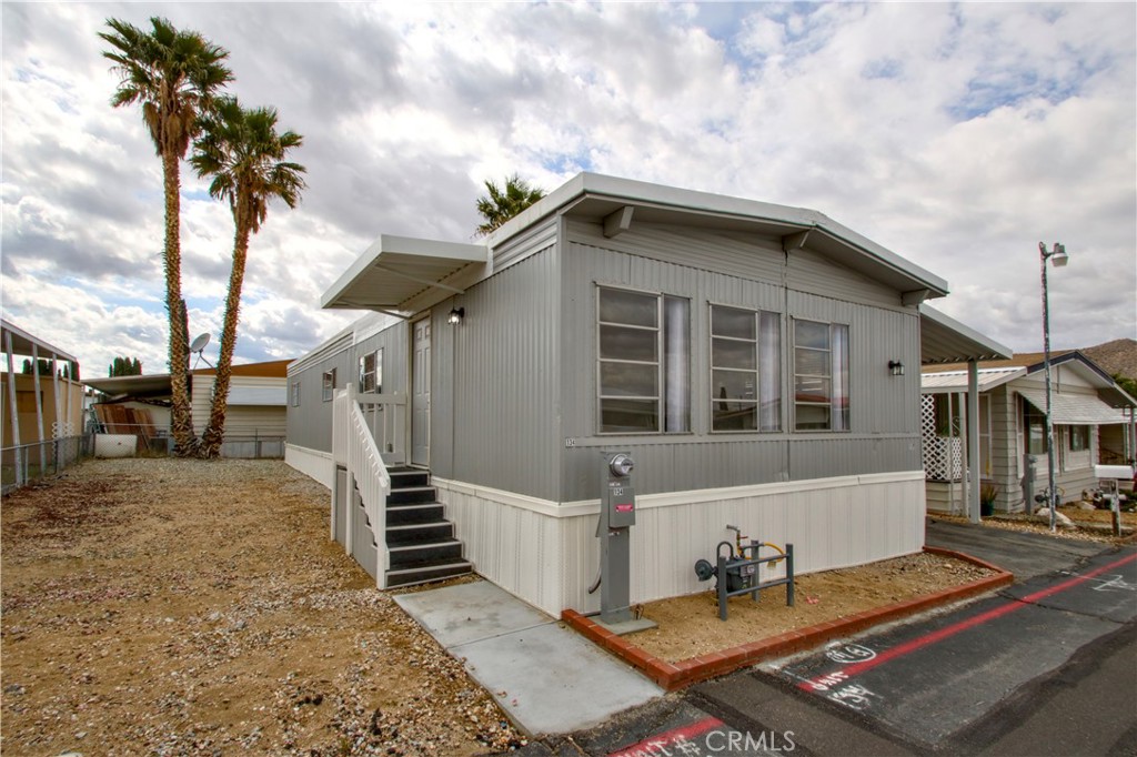 This unit is back on the market with a newly adjusted price, offering exceptional value and opportunity for discerning buyers!
This is a clean, updated double-wide ready for a new owner. Cozy kitchen with plenty of storage space for daily cooking and light entertaining. Comfortable living quarters, sizable bedrooms, and spacious bathrooms.
New exterior and interior paint, new roof, new carport awning, new carpet & linoleum flooring, serviced furnace & new AC condenser, new skirting. The washer, dryer, fridge & new stove are included.
Located off the highway in the Aztec Estates, this property is near everything you need. Old Town Yucca Valley, local grocery stores, unique gift shops, Joshua Tree Monument, & more located within a short distance!