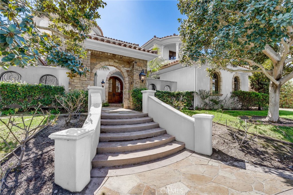 Located within the prestigious community of Rancho Pacifica, 14173 Rancho Tierra Trail offers five bedrooms and five-and-a-half bathrooms, including dual primary suites on both levels for flexible living. Designed for comfort and entertaining, the home features a resort-style pool, multiple outdoor living areas, and an updated home office.The versatile fifth bedroom can also serve as a pool cabana, second office, or home gym. Recently painted inside and out, the residence feels bright, modern, and move-in ready. Additional highlights include soaring ceilings, expansive windows, formal and informal living areas, a three-car garage, and a quiet cul-de-sac location.An exceptional lease opportunity, this home combines privacy, luxury, and the security of guard-gated living.