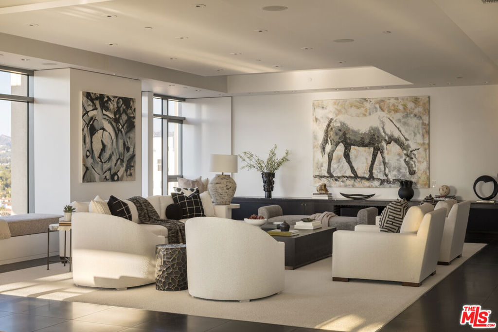 With private, direct elevator access, this spacious north-facing residence at the prestigious Californian offers a true sanctuary in the sky. Recently upgraded with new cabinetry, carpeting, and paint, this modern three-bedroom home blends clean contemporary design with timeless sophistication.Expansive floor-to-ceiling windows frame unobstructed city, mountain, and ocean views, while the open-concept living and dining areas are enhanced by a marble-lit bar perfect for elegant entertaining. The chef's kitchen features Miele appliances, a custom breakfast banquette, and a built-in television that discreetly retracts when not in use.The luxurious primary suite includes dual walk-in closets, two additional bath closets, and a spacious bathroom with separate soaking tub and shower. Four designated parking spaces are included, along with an optional separate maid's studio.Residents of The Californian enjoy world-class amenities including 24-hour concierge, valet, security, guest parking, doorman, and reception services offering the ultimate in comfort, privacy, and convenience.