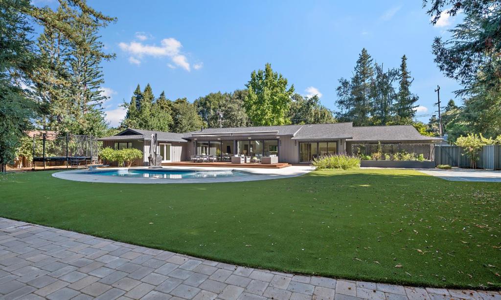 Gorgeous 4 Bedroom, 3.5 Bathroom Home with Separate Office on Flat Acre in Highly Desirable Central Portola Valley. Classic Ranch Style Home With Perfectly Landscaped Grounds, Circular Driveway, and Custom Iron Gates. Great Room With Open Space for Living, Dining, and Kitchen, All Beneath a Cathedral Ceiling With Recessed Lighting, 7.1 Surround Sound Speakers and White Oak Floors. Living Area Features a Sleek Gas-Log Fireplace Flanked By Recessed Shelves. The Kitchen is a Modern Masterpiece With Midtone and White Cabinetry, Stunning Dolomite Stone, Subway Set Tiles, Large Island With Counter Seating; Skylights and a Mudroom/Pantry. Primary Bedroom Suite Features Walk-in Closet, Secondary Closet, Double Sinks, and Sliding Glass Doors to the Rear Grounds. Nest Thermostats, Electrolux Washer/Dryer. Two Car Garage With Epoxy Floor, Built-Ins, Storage Area, And EV Charging. Lovely Landscape Design by Thomas Klope Associates, Sparkling Pool, Synthetic Lawn, Patio, Deck, Raised Bed For Vegetables, Fruit Trees, and Lavender. Large Pickle Ball/Volleyball Court. Premier Central Portola Valley Location, Easy Access to Corte Madera Creek. Award Winning Portola Valley Schools