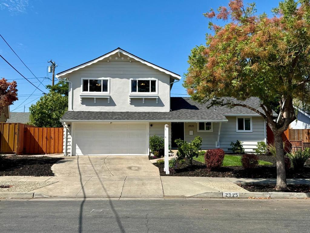 This beautifully updated Cambrian home offers an ideal blend of style, comfort, and functionality. The stunning great room addition features an open floor plan with a perfectly aligned sliding glass door that frames the spacious backyard and patio. The kitchen is a chefs dream with a large island that seats three, abundant cabinet space, and a gas range. Hardwood floors and crown molding run throughout, while two inviting living spaces include a family room with a convenient half bath and a dining area highlighted by a perfectly positioned gas fireplace. Enjoy mature avocado and fig trees in the backyard, plus blood orange and lemon trees in the front. Additional highlights include newer stained fences, dual-zone climate control via a damper system, leased Tesla solar with upgraded electrical panel, EV charger, new water heater, smart lighting downstairs, bedroom closet organizers by Container Store and a side yard shed. This home blends elegance, practicality, and modern energy efficiency in one exceptional package.