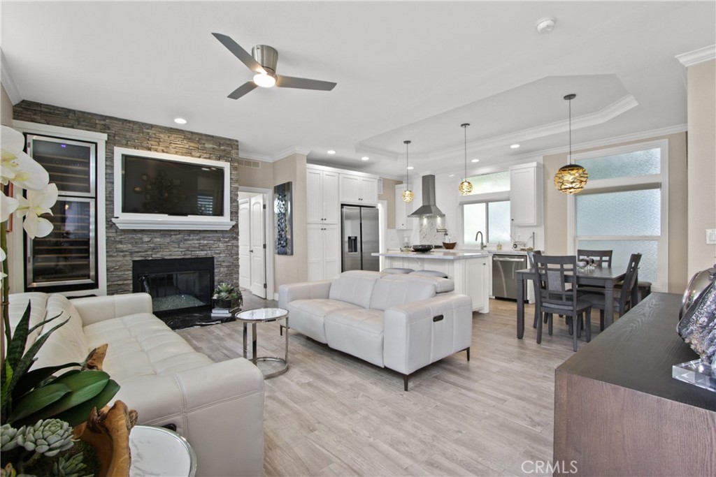 Welcome to the best kept secret in town...237 Plymouth Newport Beach. Located in the heart of Newport Beach and in the Bayside Village Mobile Home Community, a water side community offering a resort like, Newport Beach lifestyle for fractions of the cost of neighboring communities.
As you enter into this beautiful, contemporary, remodeled 3 bedroom 2 bath newer manufactured home through the
Dutch Door into an open floor plan with 9 ft ceilings and tons of natural sunlight flowing in from all parts of the home through big windows a feeling of "home" comes over one. The kitchen offers stainless steel gourmet appliances, a pot filler over the range, a porcelain farm sink, quartz counter tops and custom tile backsplash with a large island to gather around. Adjacent to the kitchen is a modern living space anchored by a gas fireplace with stacked rock surround and built in wine cabinets. Skylights, solar tubes, 5 inch base boards, crown molding, coffered ceilings, a Dutch Door, a spa like porcelain tub, tile showers and a bidet toilet in the primary bath. Custom window covering, a tankless water heater and tile floors throughout give this home a modern and impressive feel. The outdoor space offers lush landscape creating a wonderful space to entertain and enjoy the cool beach breezes. There is a builtin insulated shed that is humidity controlled for added storage at the end of the carport. This lovely home is located adjacent to plenty of available guest parking and is conveniently located to the clubhouse, pool and gym. There is air conditioning and is located in the blue ribbon school of NMSD. Total square footage is 1152 and is located on land leased land. The monthly space rent is $3200 and includes water, sewer and trash and a plethora of amenities including 2 CLUBHOUSES, 2 SATE OF THE ART POOLS, 2 JACUZZIS, A PRIVATE BEACH WITH 2 GAS FIRE PITS, A GAME ROOM, AND A FITNESS CENTER, WEEKLY STREET SWEEPING AND NIGHTLY SECURITY. BOAT SLIPS, GARAGES AVAILABLE FOR RENT. WITHIN WALKING DISTANCE TO SEVERAL BEACH ATTRACTIONS, WORLD CLASS RESTAURANTS, SHOPPING INCLUDING BALBOA ISLAND, FASHION ISLAND AND THE BACK BAY. ENJOY MANY FINE ACTIVITIES AT BAYSIDE VILLAGE SUCH AS KAYAKING, PADDLE BOARDING, WATER AEROBICS AND BOATING. COME AND LIVE THE NEWPORT BEACH LIFESTYLE FOR LESS! No Land Taxes or HOA Dues New residents subject to park approval by Bayside Village Mngt. Land Leases subject to annual increases.