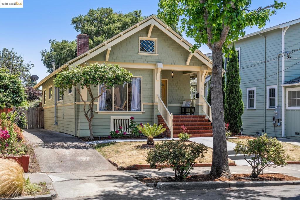 Welcome to 1634 Derby Street, a charming Central Berkeley home with a seamless indoor-outdoor living and an expansive yard. Step inside to a light-filled front room with floor-to-ceiling windows—perfect for a home office, guest space, or additional bedroom. An updated full bathroom sits just adjacent The inviting living room boasts a wet bar, perfect for entertaining. The kitchen has been updated and opens to the dining room, which in turn leads out to a magnificent backyard. Here, a majestic oak tree provides shade and a sense of serenity. Off of the living room, find one of the bedrooms followed by the primary with an en suite bathroom and its own private access to the yard. Enjoy exceptional indoor-outdoor flow—step directly from the dining room onto a spacious deck and yard, full with potential for outdoor living, play, or even the addition of an accessory dwelling unit (ADU). The street couldn't be lovelier, and from it you can stroll to get fresh groceries at Berkeley Bowl, or the tool lending library, your favorite gym or the many other amenities on Shattuck Ave. A few minutes away, Grove park is great for kids, pets - or tennis!