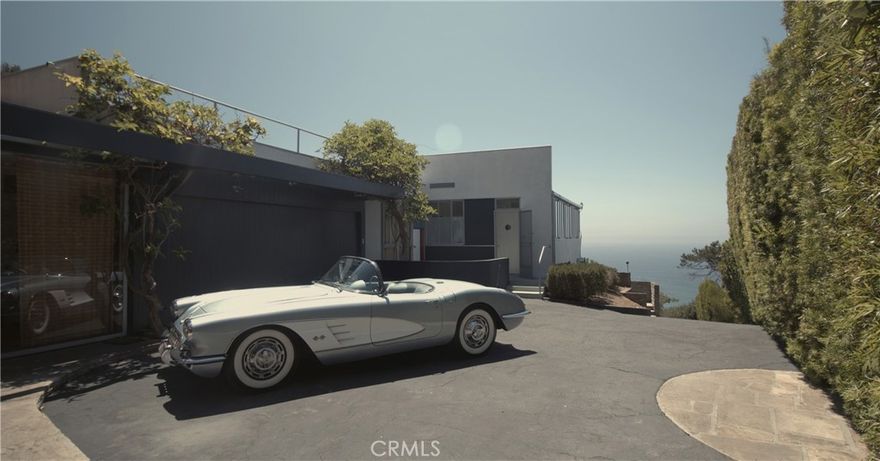 Architectural Masterpiece by Richard Neutra – Malaga Cove. Step into history (and a little architectural legend) with this all-steel residence, one of Richard Neutra’s most exacting and delightfully over-engineered designs. Perched at the southwest corner of the northwest corner of prestigious Malaga Cove, the home enjoys a 270° due west-facing panorama of the Palos Verdes Cove and the endless Pacific—basically front-row seats to the world’s most reliable sunset show. Commissioned by Dr. Beckstrand, the home gave Neutra the freedom to experiment like a mad scientist in a drafting room—debating the exact gauge of aluminum light troughs, perfecting the connection of steel sash windows, and designing sliding glass-and-steel doors so guests could drift between the living room and patio without spilling a drop of their drink.  When the HOA insisted on Spanish tile roofs, Neutra politely disagreed… and found a way to make it work anyway, designing parapets that kept his modernist vision intact. Acting as his own general contractor, he chased bids for everything from major steelwork to the andirons by the fireplace, because no detail was too small for his obsession. This isn’t just a home—it’s a living piece of architectural art with the Pacific Ocean as your backdrop and a designer who thought of everything so you wouldn’t have to.