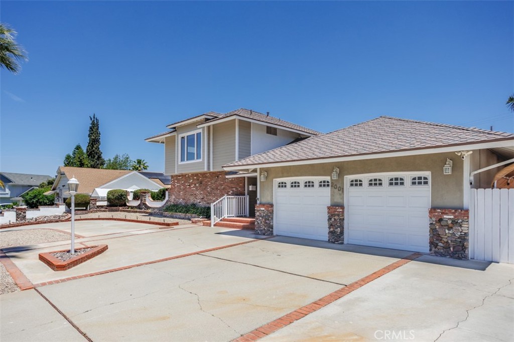 Stunning 4-Bed, 2-Bath Two-Story Home in West Corona!
Step inside this beautifully updated home boasting a bright and open floor plan flooded with natural light. The spacious family room with elegant French doors flows seamlessly into a open kitchen featuring a center island and rich oak cabinetry—perfect for your large family gatherings.
A private downstairs bedroom with an upgraded modern restroom. Upstairs, find three generously sized bedrooms and a full size bathroom.
Entertain in style in the expansive backyard with a built-in BBQ, cozy fire pit, and breathtaking mountain views—along with your private spa -your personal oasis for summer gatherings. Recent upgrades include a new roof, plumbing, AC unit, and furnace, showcasing true pride of ownership.
Located just minutes from Orange County, this home combines comfort, style, and location in one incredible package. Don’t miss out! This is a commuters delights.
