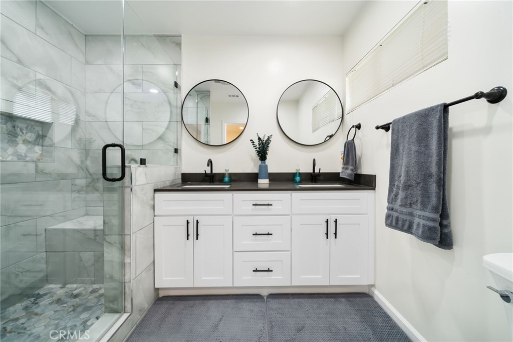 Welcome to your beautifully reimagined retreat in the heart of Lakewood Park, where charm meets modern comfort on an oversized corner lot, directly across from Heartwell Golf Course and Park.
This move-in-ready 3-bedroom, 2-bath home offers 1,316 square feet of stylish living space, loaded with thoughtful upgrades from top to bottom.
Step into a completely renovated kitchen featuring sleek shaker cabinets, quartz countertops, and a full suite of brand-new Samsung smart appliances, including an oven with a built-in air fryer. The adjacent laundry area includes a side-by-side gas washer and dryer, seamlessly integrated into the design.
The primary suite is a true sanctuary, boasting a spacious layout and a luxe ensuite bathroom with dual vanities, a walk-in shower with bench seating, and high-end modern finishes. The center bedroom is impressively large, with a sliding glass door that opens to the back patio, perfect for indoor-outdoor living. Two of the bedrooms include custom oak closets for added function and character.
Outside, the upgrades continue: enjoy lush landscaping with automatic sprinklers, privacy-enhancing vinyl fence toppers, and fresh stucco work that ties it all together. The garage is fully finished with a custom paint job and epoxy floors, plus a 20' x 5' custom side extension, ideal for RVs, toys, or extra storage.
Love to entertain? You’ll adore the massive breezeway, a shaded outdoor lounge with recessed lighting, connecting the house and garage for effortless hosting.
This home also has a 16 security camera system for added safety.
Major system upgrades include:
New Copper Plumbing throughout.
Full Electrical Rewire and Panel Upgrade.
Tankless Water Heater.
Central A/C and Heat.
Dual-pane Vinyl Windows.
Modern tile and wood-like flooring.
Roof replaced in 2015.
Best of all, you're nestled in one of Lakewood’s most desirable neighborhoods, known for its tree-lined streets, top-rated schools, and unbeatable sense of community. With Sprouts, Vons, HomeGoods, Long Beach Towne Center, YMCA, and Lakewood High School all just minutes away, convenience and lifestyle come standard.
And with Heartwell Golf Course just across the street, you’ll enjoy serene park views, without the golf course price tag.