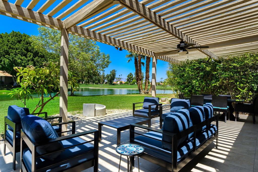 SEASONAL LEASE AVAILABLE FOR 2026! (3 month minimum lease). Lakefront 3 bedroom/3 bathroom condo at Mission Hills CC. Updated throughout - freshly painted, new stylish furnishings and golf cart! The covered and tiled patio is ideal for indoor/outdoor living, with BBQ and a fire feature, and expansive lake, mountain and fairway views of the Tournament Course. Light & bright, the open floor plan includes living room, dining area and kitchen - all open out to the patio with those great views. Living room features a fireplace and vaulted ceiling with wood beams. The re-designed Kitchen features custom cabinets, glass & stainless bar counter with seating, upgraded stainless appliances, granite slab countertops and dining area. Primary Suite offers views and private access to the patio. Updated ensuite bathroom has double vanity copper sinks, spa-like shower and separate tub. Two guest rooms each have adjacent bathrooms and open to the private gated front courtyard. Individual laundry room and a detached 2-car + golf cart garage. One of the many community pools/spas is just off the private front courtyard. Mission Hills CC offers a variety of membership options available for tenant to purchase for the season.