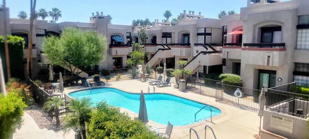 Welcome to this Amazing move-in ready, 2-bedroom, 2-bath upstairs condo located in a highly desirable Palm Springs community. This spacious unit offers a bright and open floor plan with excellent separation between the living area and bedrooms, enhanced by a custom glass door that adds style and privacy. Enjoy tasteful upgrades throughout, including 20-inch tile flooring, crown molding in the living room and bedrooms, and a cozy fireplace perfect for relaxing evenings. The kitchen and bathrooms have been updated with newer vanities and custom tile showers. Both bedrooms are generously sized, each with ample closet space and a tranquil feel. The living room provides beautiful views of the community pool and breathtaking Palm Springs mountains. Ideally located just minutes from shopping, dining, downtown Palm Springs, and the airport. Whether you're looking for a primary residence, vacation home, or investment property, this condo is a true desert gem.