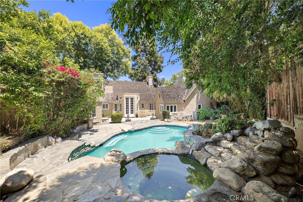 Situated within a prestigious location of San Marino is an extraordinary home on an extensive lot. Greeting upon entry is the spacious living room complete with soaring ceilings. Windows throughout allow for rays of sunshine to pour in, creating an abundance of natural lighting. Kitchen and dining fill one side of the home while the primary suite and additional bedrooms complete the other. Upper level holds a generous loft and remaining bedroom. Outdoor area features a pool and open area, perfect for entertainment. Additional highlights include driveway gate, convenient location, and many more. Fit for a primary residence or perfect for a flip opportunity, this is a home that can cater to all. Closely located to Lacy Park, top schools, shopping, and dining, the location offers utmost convenience.
