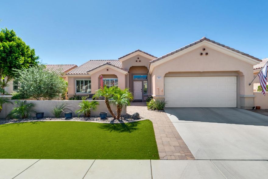 Welcome to Sun City Palm Desert, THE premier 55+ community in the Coachella Valley. The Montego is one of the most popular models with 3 bedrooms and 2 bathrooms. This beautiful home features a large north-facing enclosed courtyard with brick pavers, a refreshed kitchen, beautiful luxury vinyl floors throughout, new baseboards, new interior paint and plantation shutters. The primary suite is extended with a sitting area and the primary bathroom has dual vanities and a custom closet system. The guest bedrooms and bath are on the opposite side of the home allowing comfort and privacy. The open-concept floor plan has a spacious kitchen with a cozy breakfast kitchenette. It opens to the dining room and living room with a new slider out to the spacious private south-west facing private backyard with an extended patio of pavers, grass turf and portico. The indoor laundry includes the washer/dryer, wine refrigerator and upper cabinets. The HVAC system and water heater were replaced in 2020. This is a beautiful move-in ready home!