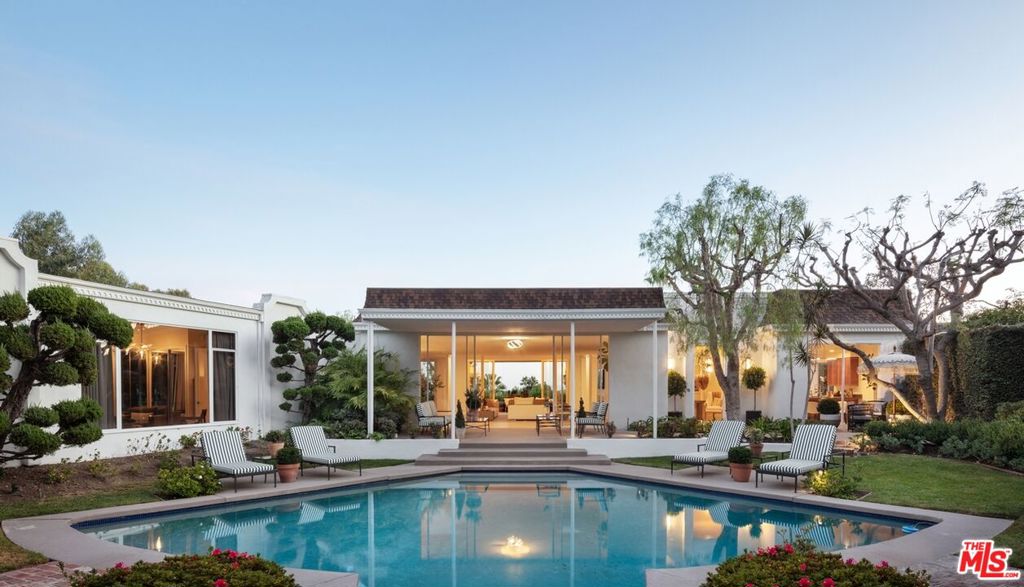 Blue chip location in Beverly Hills with city views. Mid-century home located on a private cul-de-sac perched over the city adjacent to the renowned Greystone Mansion (former Doheny family home). Enter through the gate to discover a hidden oasis with a resort pool and lush greenery, reminiscent of old Hollywood. Large floor to ceiling windows showcase the expansive views from almost every room. A sprawling primary suite with fireplace, intimate bar and lounge , a chef's kitchen and grassy yard are among some of the amenities this home has to offer. Surrounded by the best and most valuable estates in Beverly Hills. Can be purchased with neighboring property, 520 Stonewood Drive, which include plans for an estate approaching appx 20,000 SF designed by award winning design firm Walker Workshop.