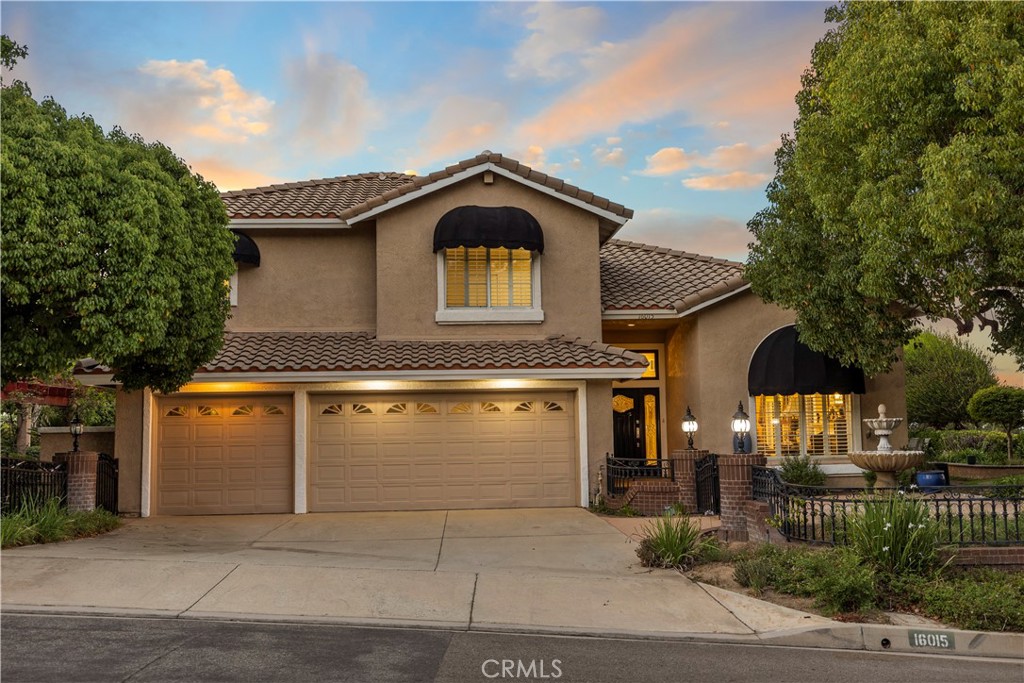 Welcome to 16015 Ranch House Rd, a beautifully upgraded retreat in the coveted Carriage Hills community of North Chino Hills. Set on over half an acre, this 5-bedroom, 2.5-bath home offers nearly 2,900 sq ft of elegant living space with breathtaking 270° mountain and city-light views.
Step inside to find soaring ceilings, a dramatic two-story entryway, and fresh interior paint complemented by newly added recessed lighting throughout. The formal living and dining rooms feature a cozy fireplace, while the remodeled kitchen boasts granite countertops, stainless steel appliances, custom cabinetry, and a seamless flow into the spacious family room with built-ins and a second fireplace.
The highly sought-after first-floor primary suite includes a spa-inspired bath with dual vanities, soaking tub, walk-in shower, and private backyard access. Upstairs are four additional bedrooms and a full bath, perfect for family or guests.
Outdoors, enjoy two charming arbors, a built-in BBQ, and panoramic vistas—ideal for entertaining or peaceful evenings under the stars. With recent upgrades, a newer HVAC, plantation shutters, and access to top-rated schools, this home delivers both comfort and convenience in one of Chino Hills’ most desirable neighborhoods.
Come experience the perfect blend of luxury, privacy, and California charm.