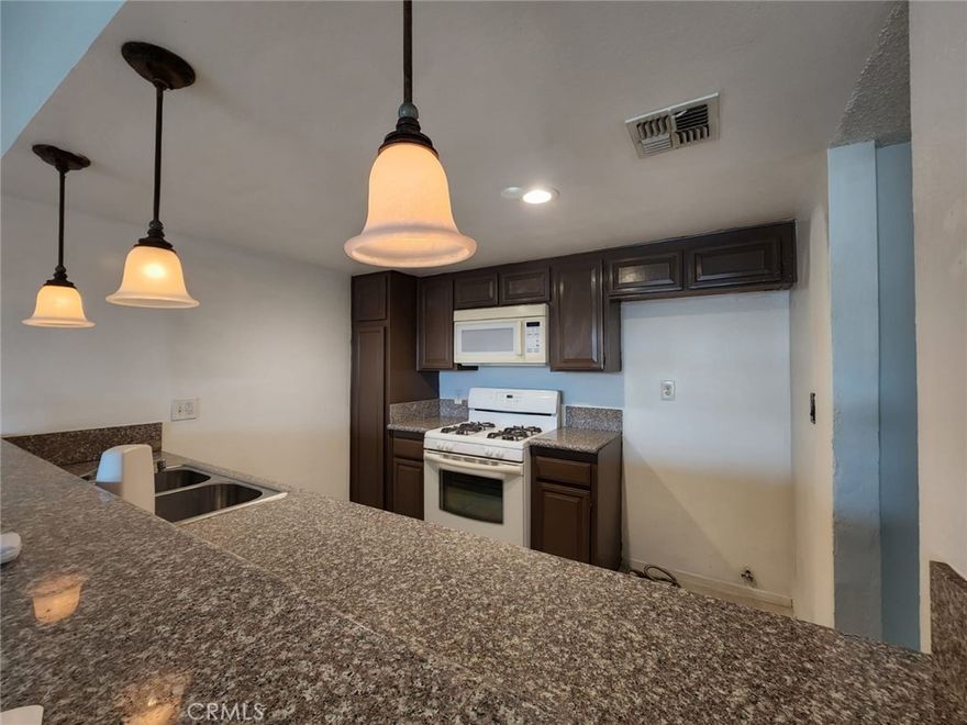 This upstairs 2-bedroom, 1-bathroom condo is perfect for first-time buyers or investors. Enjoy the convenience of an in-unit washer and dryer, along with an additional private storage unit located in the parking area behind the building. Ideally situated near a variety of restaurants, shopping centers, and supermarkets, this condo offers both comfort and convenience.