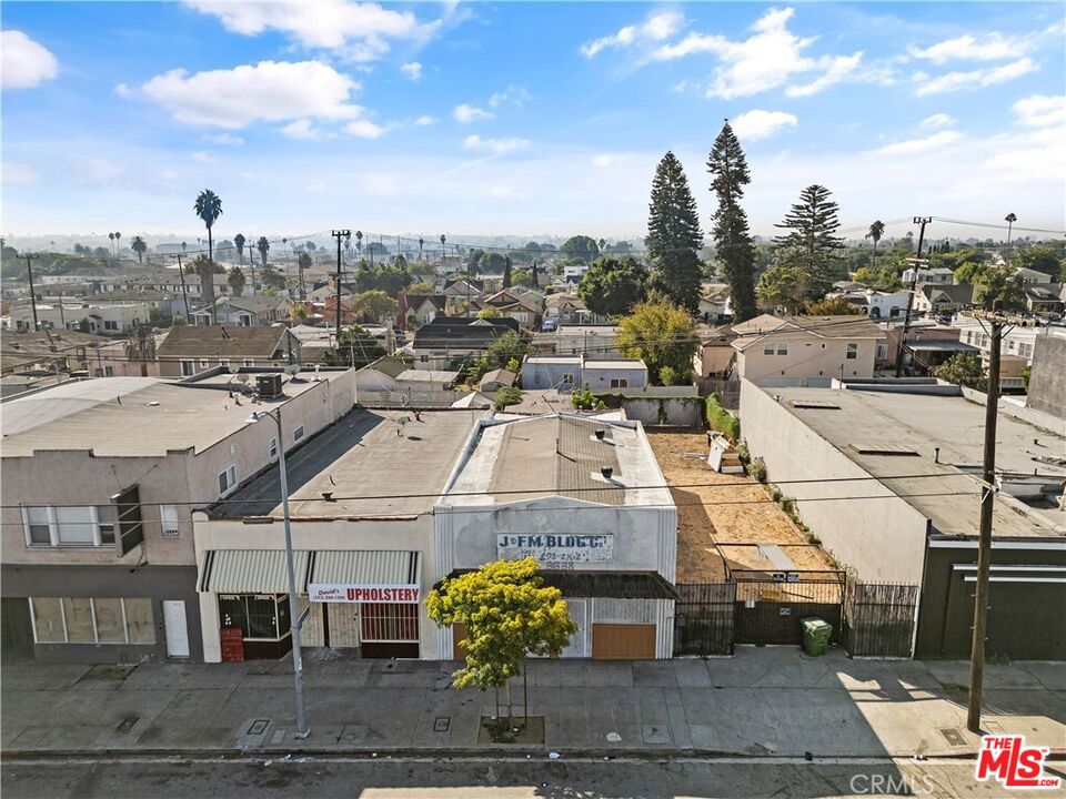 Prime Mixed-Use Space with Bonus Lot! Exceptional leasing opportunity - versatile mixed-use property offering flexible office and residential space, along with a massive 2,750 sq ft adjacent lot for parking, storage, etc. Positioned in a high-visibility location with easy access to the 110 and 105 freeways, this dynamic property is perfect for businesses needing office space, creatives seeking a live/work setup, or organizations looking for a functional headquarters with room to grow. The front of the building has secure entry with open office spaces and a bathroom. The back side of the building has living space with full kitchen, bathroom, bedroom, dining area, living room with large skylight, and outdoor patio. Bonus: 2,750 Sq Ft Vacant Lot Included with lease with automatic gated entry facing Slauson with secure access, and additional gate access from alley to the back of building. Highlights: Great street frontage with signage potential, Ample private outdoor space, Minutes from Downtown LA, Inglewood, and major transit corridors. Don't miss this rare chance to lease a property with both functional space and future potential.